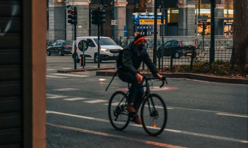 a person riding a bicycle on a street