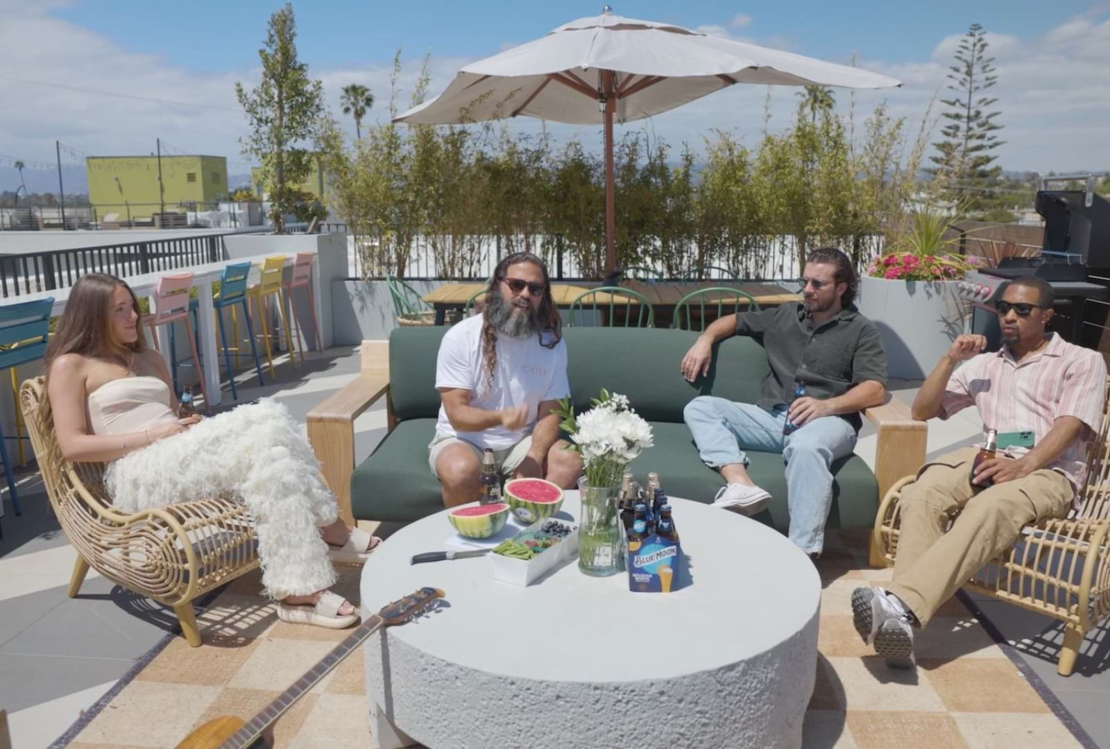a group of friends sitting on a patio