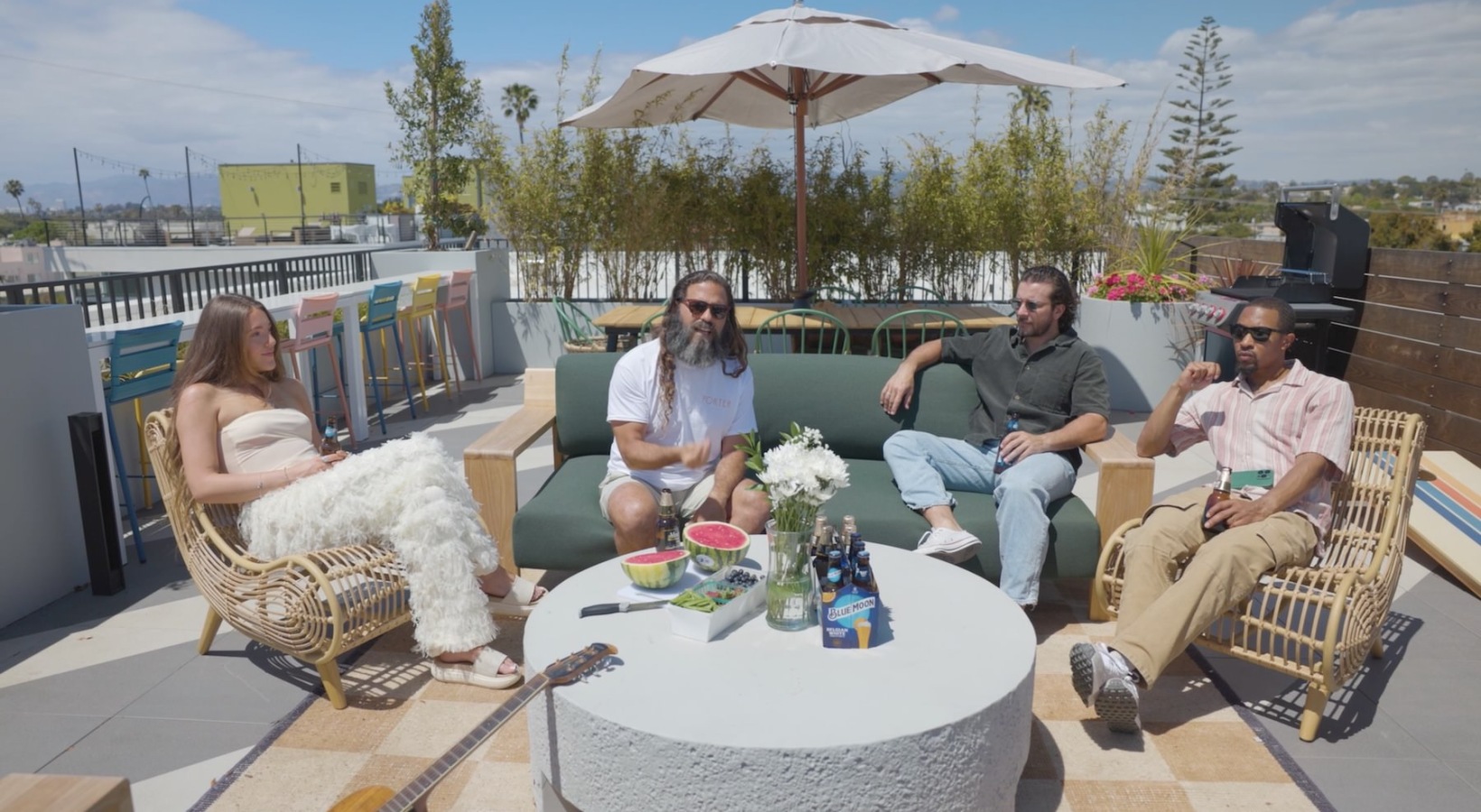 a group of friends sitting on a patio