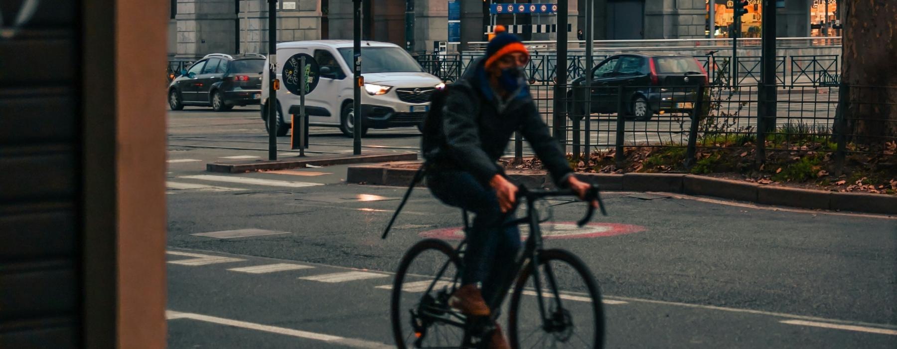 a person riding a bicycle on a street