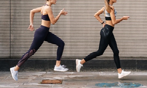 A perfect fit for the whole family two women running on a street
